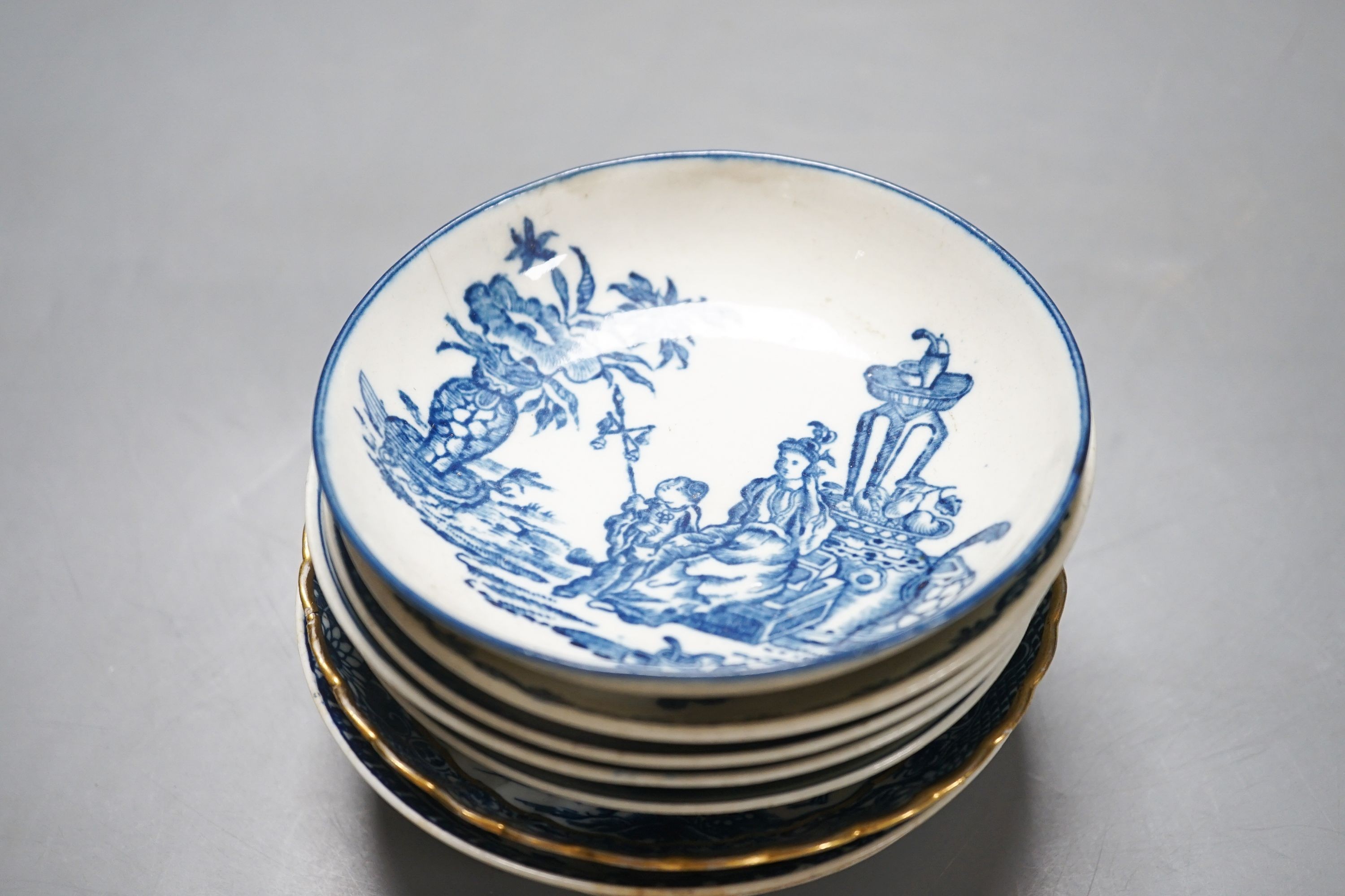 A group of Worcester and Caughley blue and white tea and coffee wares, late 18th century including fisherman pattern, three flowers pattern, chinoiserie figures etc.